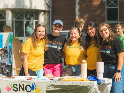 Students at the annual involvement fair, smiling and having fun
