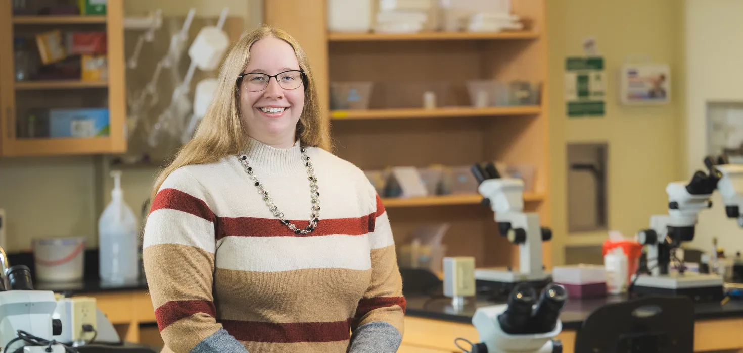 SNC grad Paris Wills in a science lab