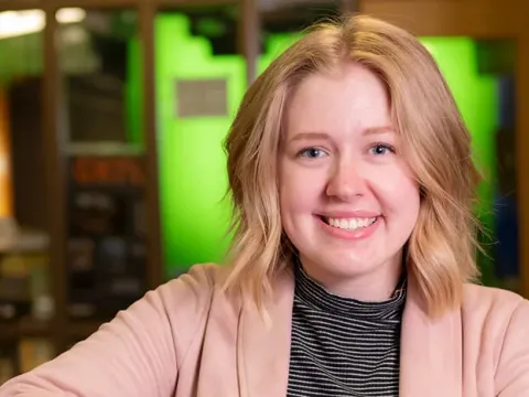 Image of female student in a media studio