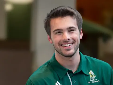 Male student in a green polo