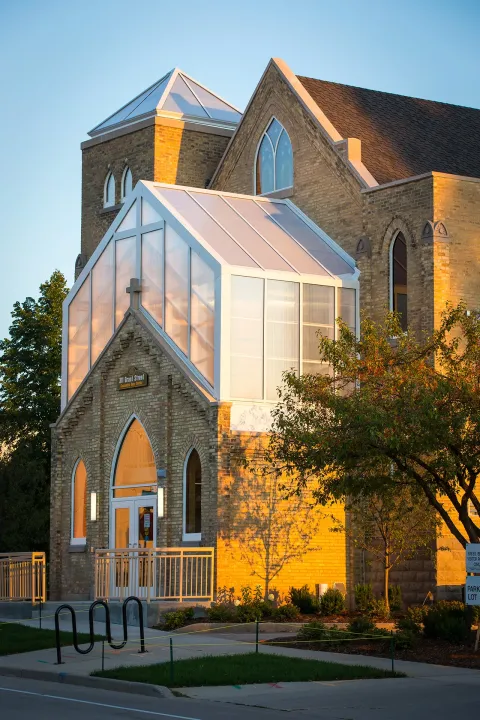Brick building with glass windows on campus