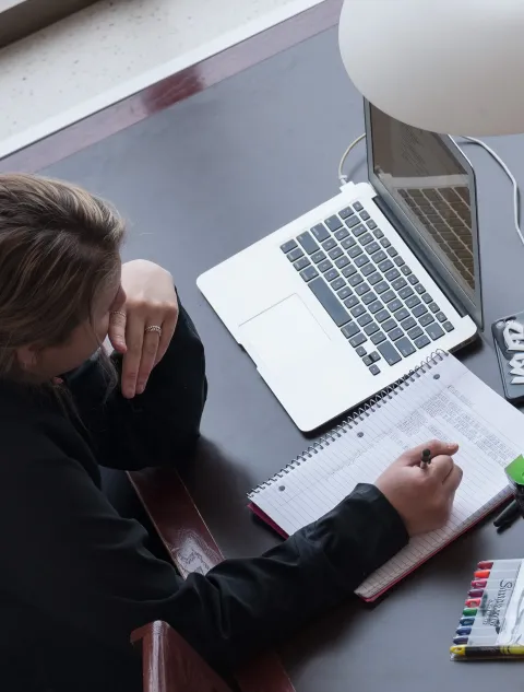 A student working on a computer at a desk