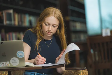 Female student studying in the library
