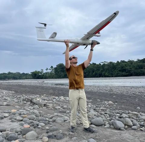 Matt Larson holds drone used in research