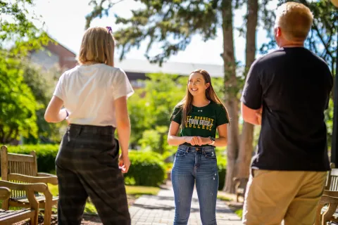 A student giving a tour on campus