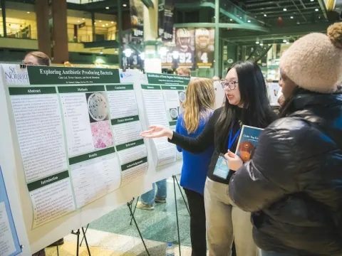 Students presenting at Tiny Earth Symposium