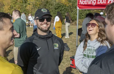 People at an event wearing SNC apparel