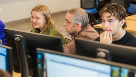 Professor and students in a computer science class